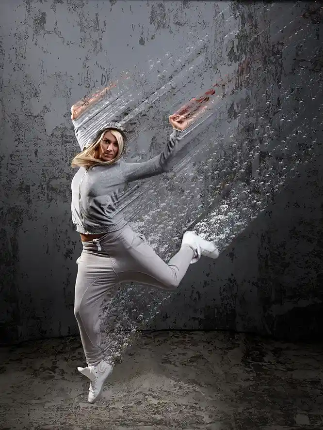 Woman leaping in the air with a decaying special effect.